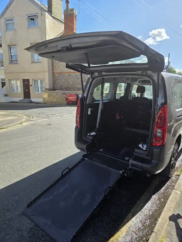 Mildenhall Wheelchair Accessible Vehicle (WAV) taxi waiting for customer.